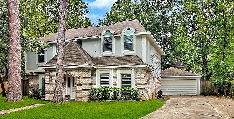 Notice the large driveway with plenty of room for additional parking. Detached two car garage is located nicely toward back of property. There is a covered walkway from garage to house.