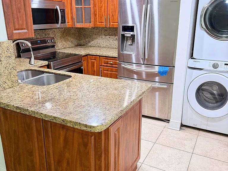 Kitchen with washer and dryer.