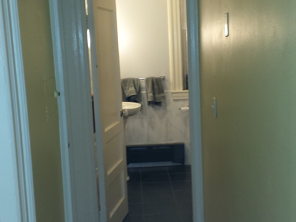 Hallway to shared bathroom