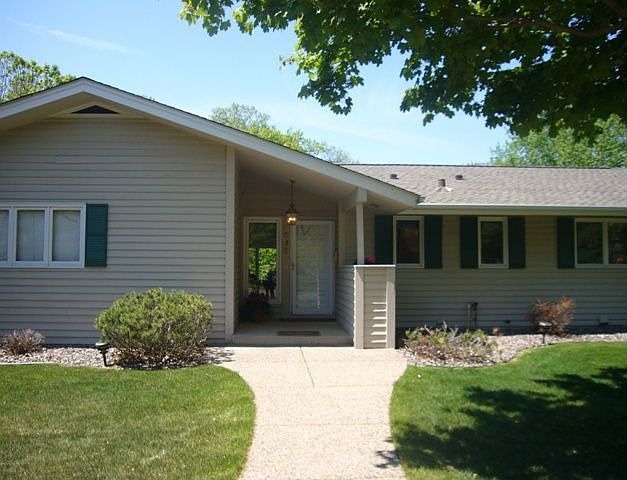 Front entrance of this wonderful WO rambler on huge corner lot