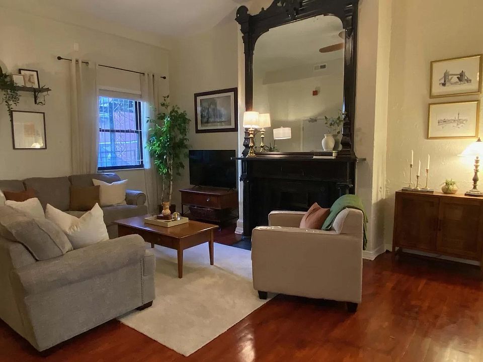 Incredible living room with 12 foot antique fireplace!