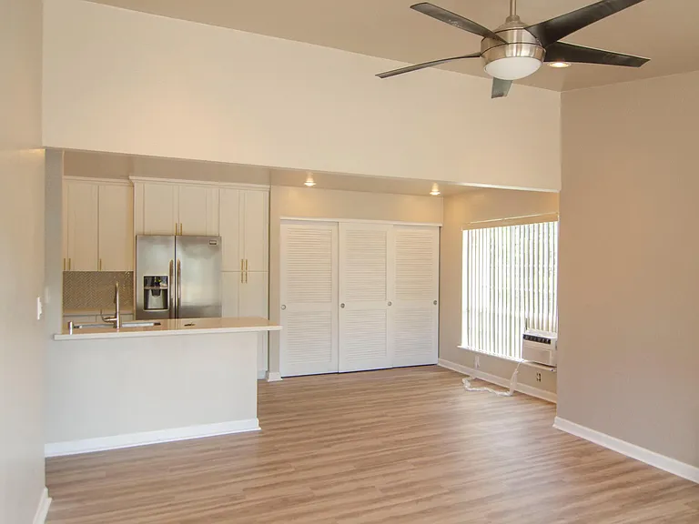 Living and dining space comes with ceiling fan, A/C, and storage closet. Large windows in both spaces provide plenty of natural light/airflow.