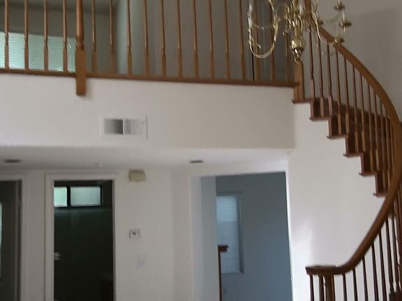 Sweeping staircase up to loft area