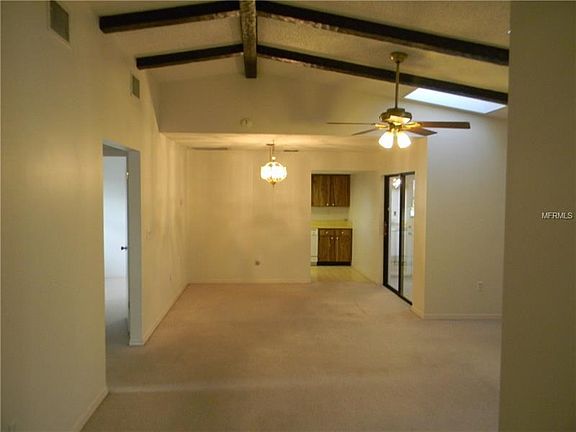 Great-room effect showing cathedral ceiling, Kitchen in rear & bonus room w/ dbl. glass doors