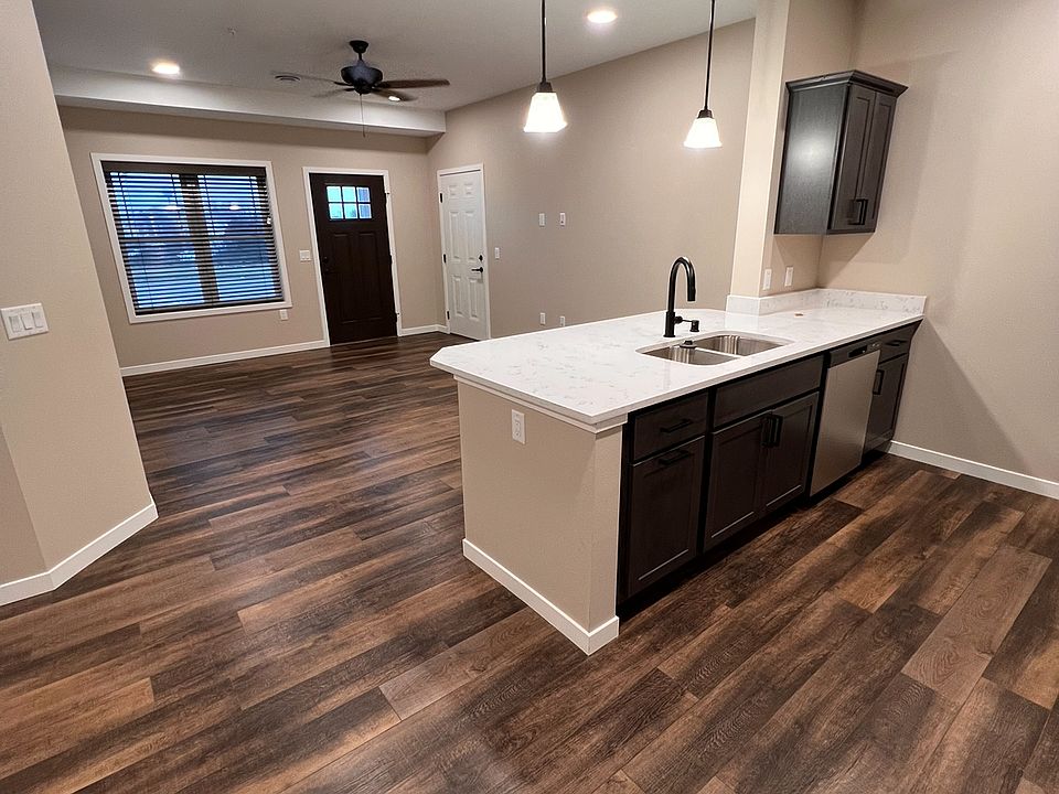 Kitchen bar/view into living room, front door to outside