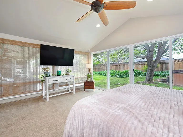 Primary Bedroom with floor-to-ceiling windows
