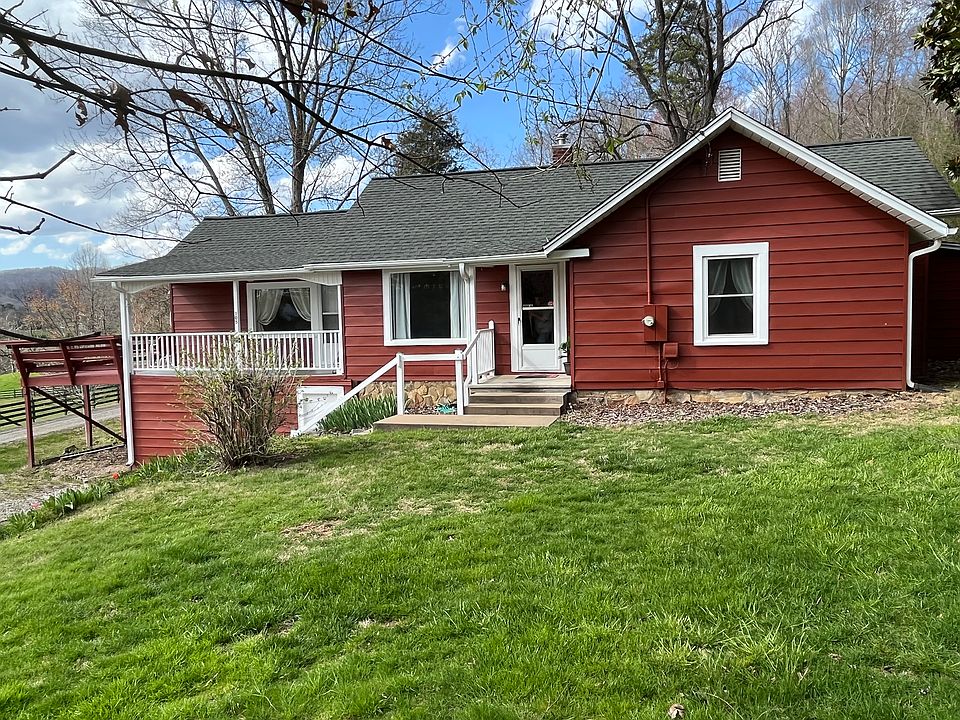 Frontal view of house with deck on left side. Unfurnished.