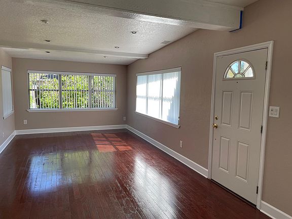 Picture 2 of 2 of Living Room. Note the natural light available.
