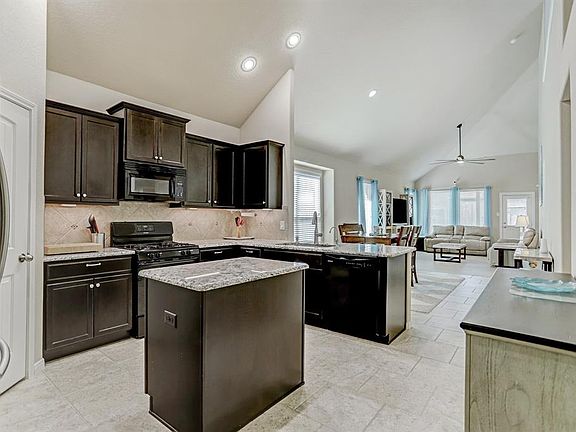 Expansive living spaces with open concept kitchen, living and dining areas.