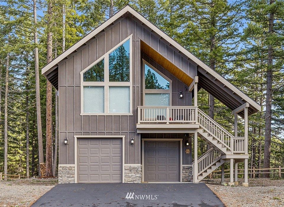 Front of home, 2 car garage. Photo from a similar cabin.