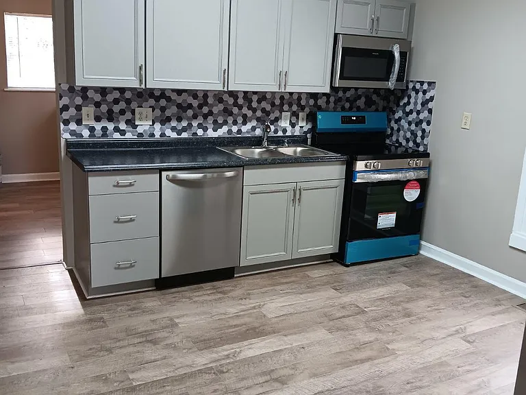 New kitchen (the stove isn't blue still has the stickers on it)