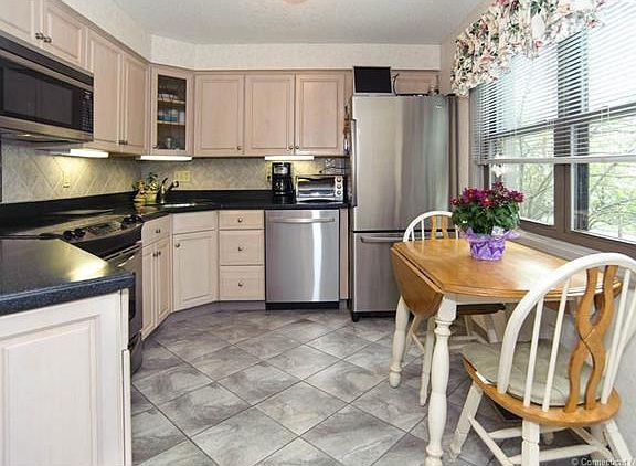 Gorgeous, eat-in kitchen is...