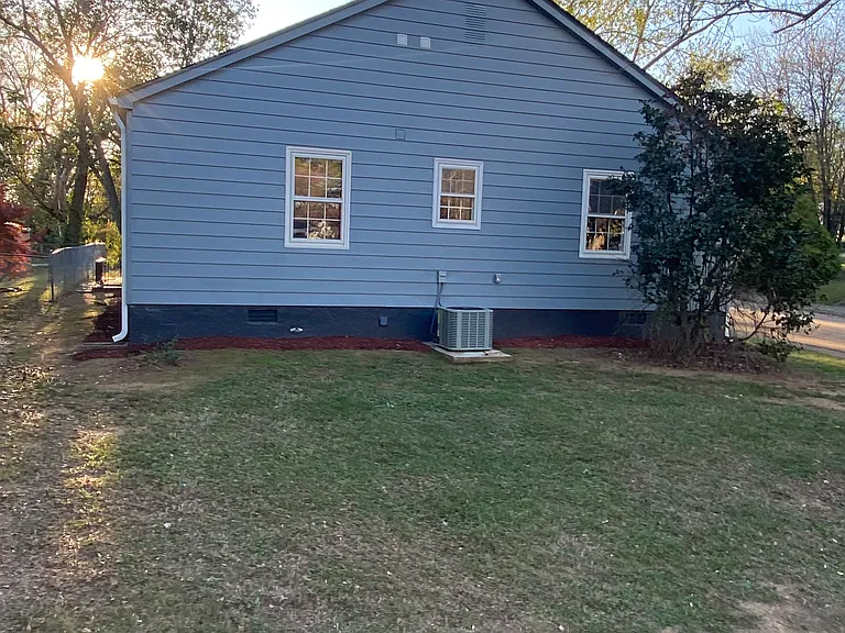 Left side of the home, new HVAC, plenty of lawn space.