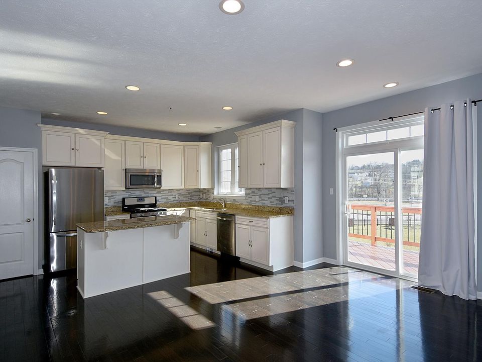 Updated gourmet kitchen with lot of sunlight