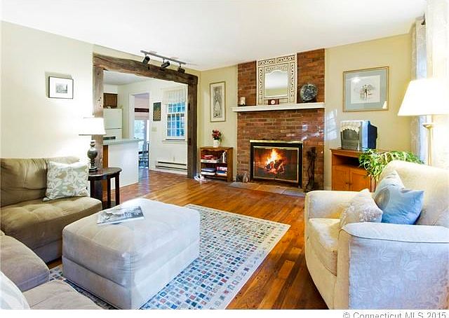 A cozy living room with fireplace welcomes you.