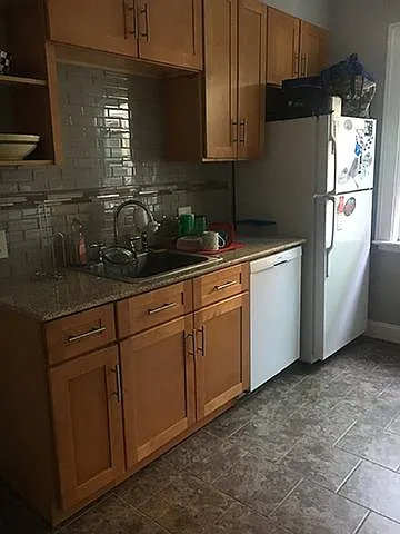 kitchen has overhead fan and track lights