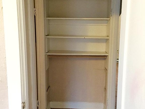 Linen Shelves next to bathroom