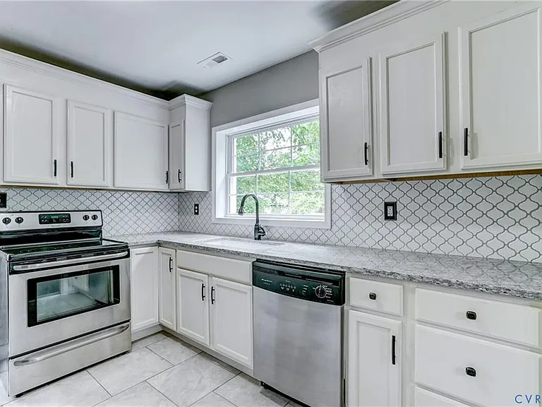 Tile backsplash, stainless appliances, updates fixtures and so much more!