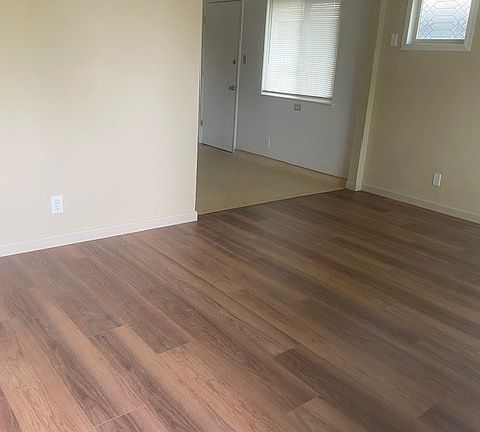 spacious livingroom with NEW, easy clean, Pergo Flooring