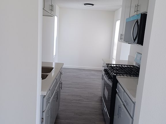 all new kitchen leading to large dining area