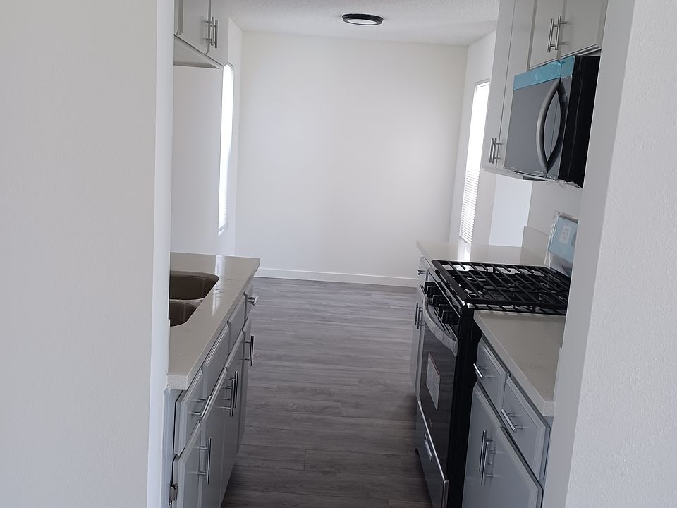 all new kitchen leading to large dining area