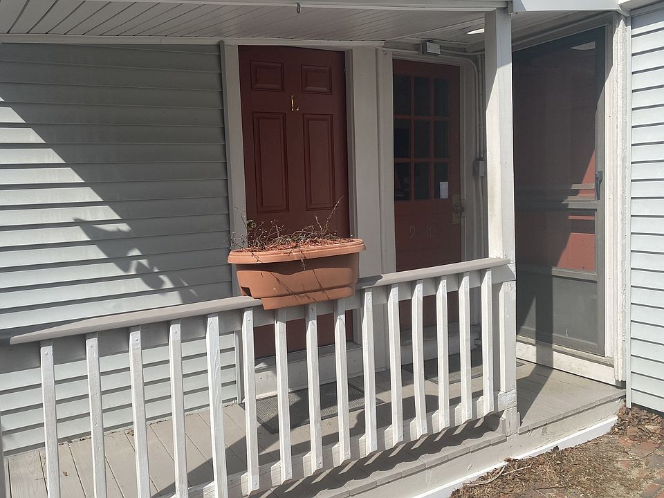 Apt #7, Front door (brown screen door)