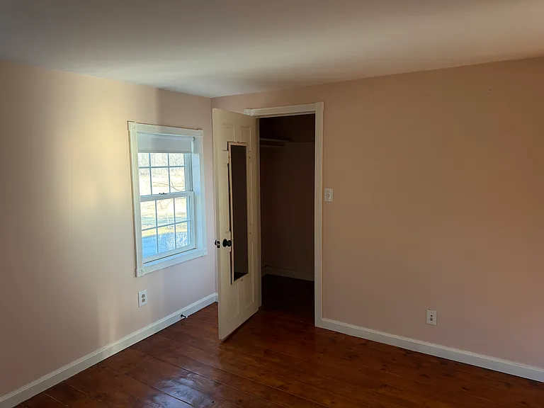 Second bedroom, currently being painted white