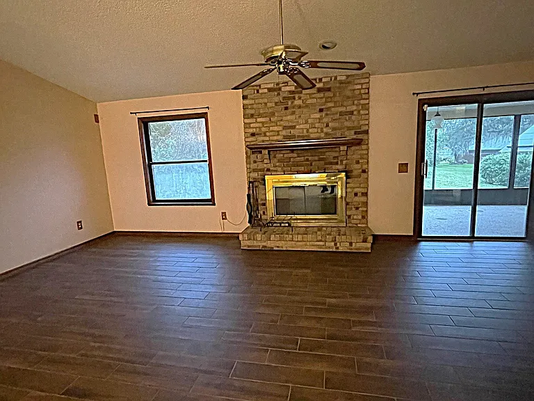 Living room with decorative fireplace.