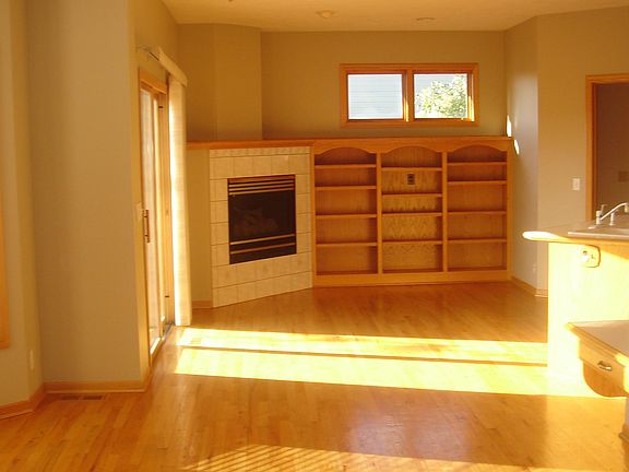 From left to right: Breakast nook, dining area, kitchen island, office build in