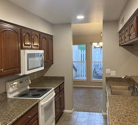Ample counter space, oven, stove, microwave, double kitchen sink