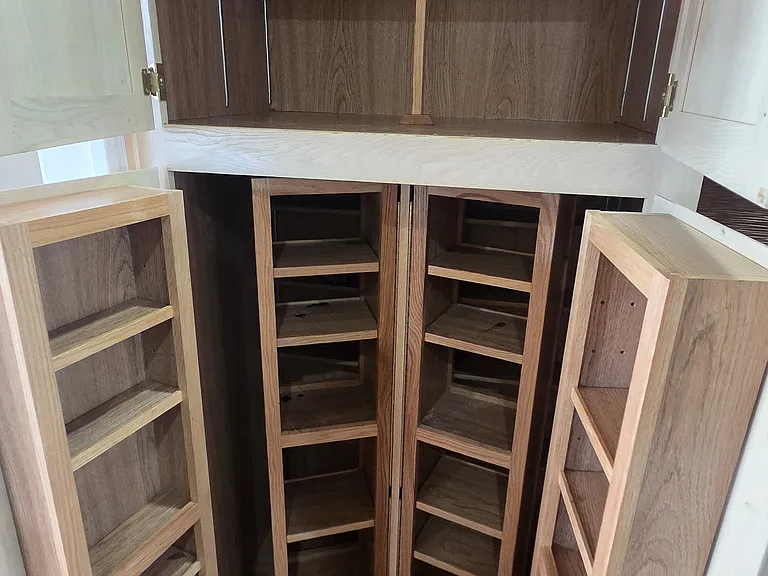 Chef's dream spice cabinet in kitchen.