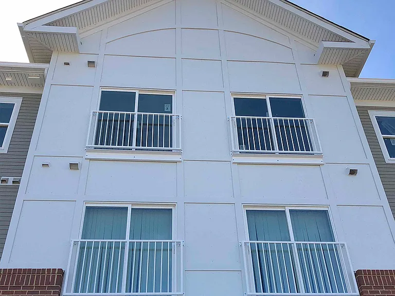 Exterior front of building with windows