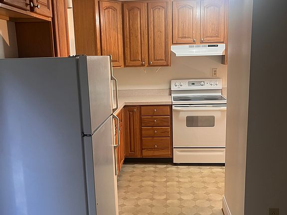 Kitchen with lots of cabinets, storage, electric stove, refrigerator and dishwasher
