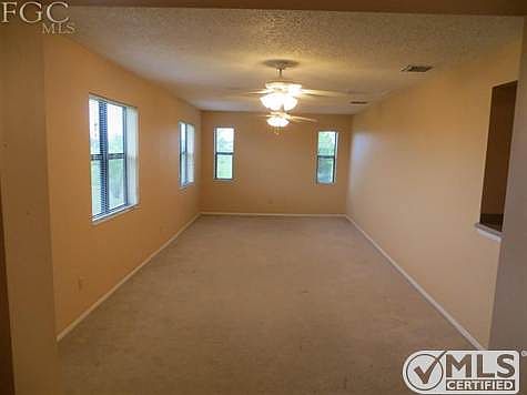 Sunroom with exterior door to the rear of the home on the left.