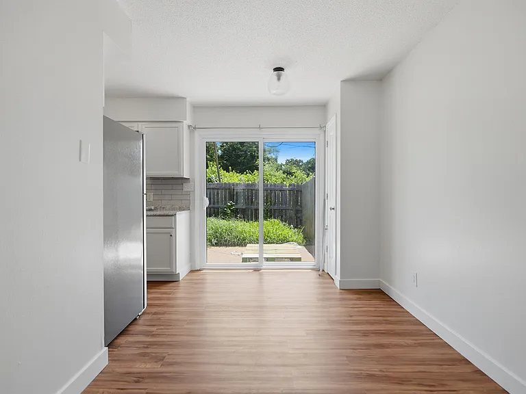 Bright living room with new flooring and fresh paint