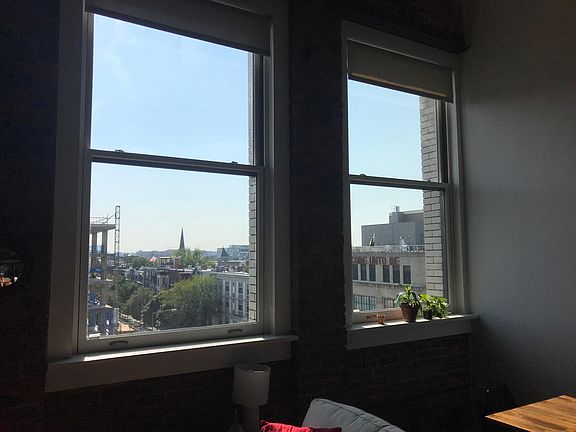 Double ~10 foot high windows provide great light and views