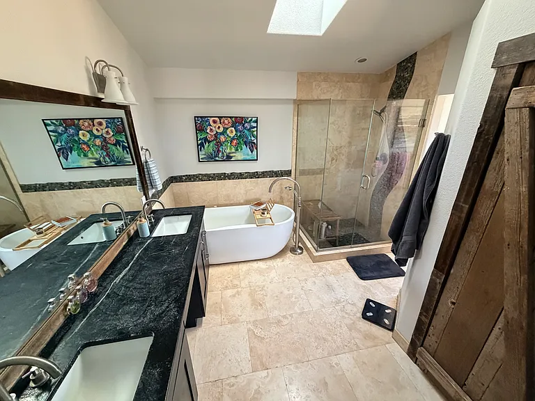 Master bathroom with soaking tub, double sinks, walkin closet, beautiful shower, heated floors, skylight