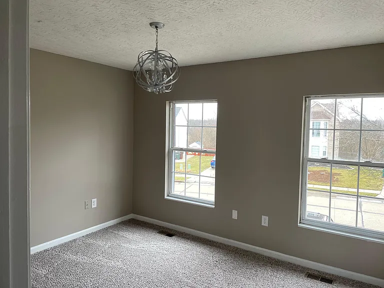 2nd bedroom main floor. New carpet and paint. Double closet. Lots of light!