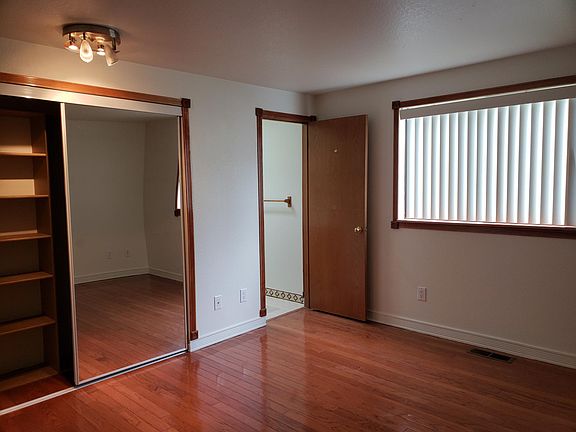 Master bath with hardwood floors