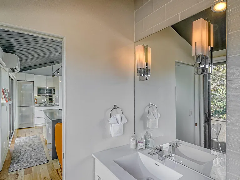 Remodeled bath with oversized glass tile