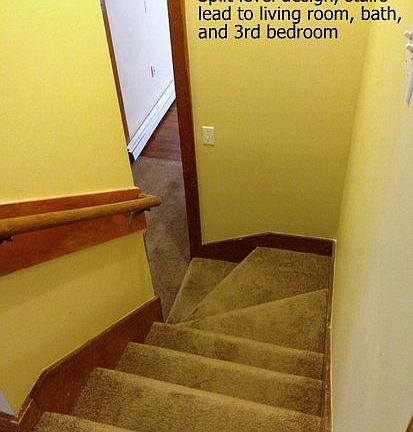 Split level design offers stairs to upper level featuring li