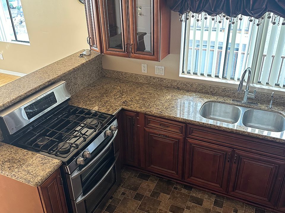 Gas stove and oven.. with large sinks and modern faucets with garbage disposal!