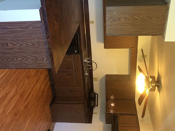 Kitchen with dishwasher, cabinets run full length of island
