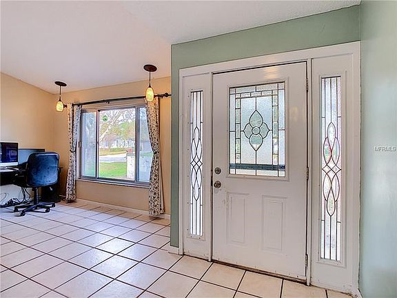 Plenty of natural light in the formal living room and foyer.