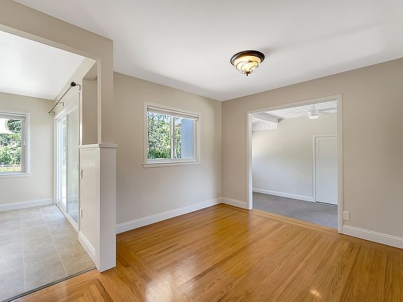 The dining room with connection to the kitchen, living room, and bonus room.