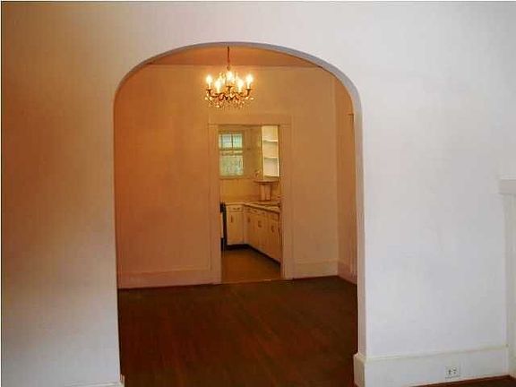 Archway from living room to dining room.