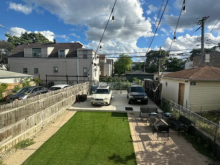 backyard w/ private parking pad
