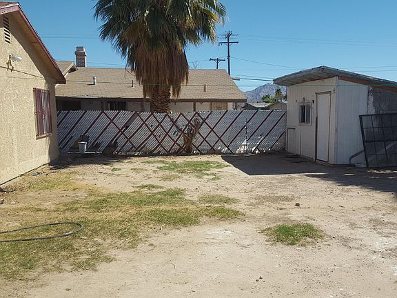 Side view of back yard and shed