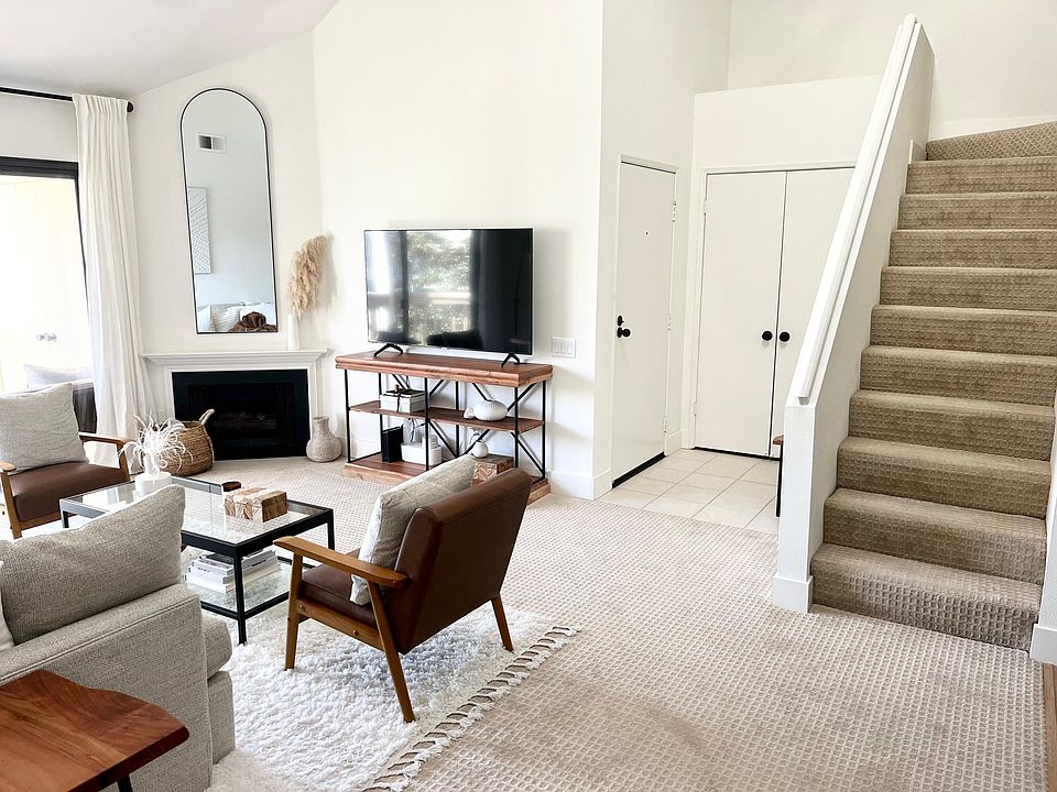 Entry with long closet under the stairs; stairs up to loft