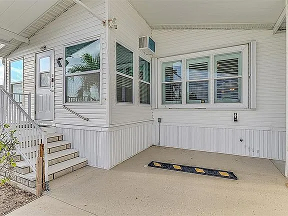 Uniquely designed Front Elevation with huge shed attached for storage. All windows have storm shutters for your protection.